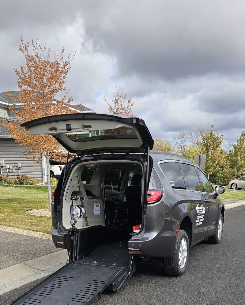 Rear view of the Kingdom Concierge Services van with wheelchair ramp deployed