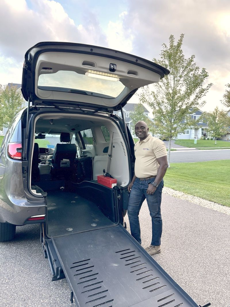 Kingdom Concierge Services driver Niyi Adekunle with the deployed wheelchair ramp